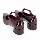 Decolte c/cinturino e  tacco in vernice